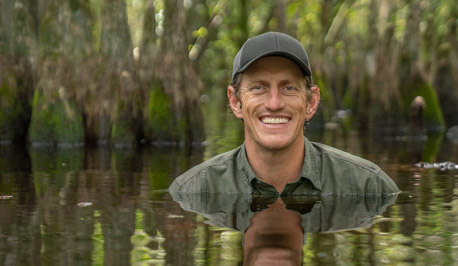 Carlton Ward Jr. neck deep in a Florida swamp