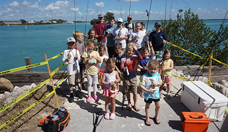 kids and adults with fishing gear
