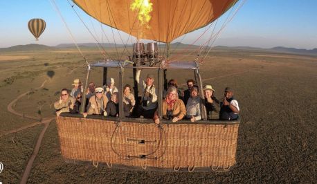 Friends Travelers in Hot Air Balloon Safari